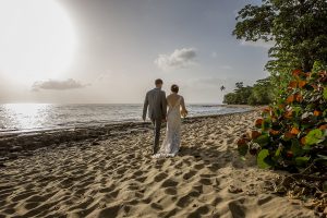 Wedding couple walking hand in hand on Maria's Beach PR