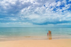 Family wading in the ocean