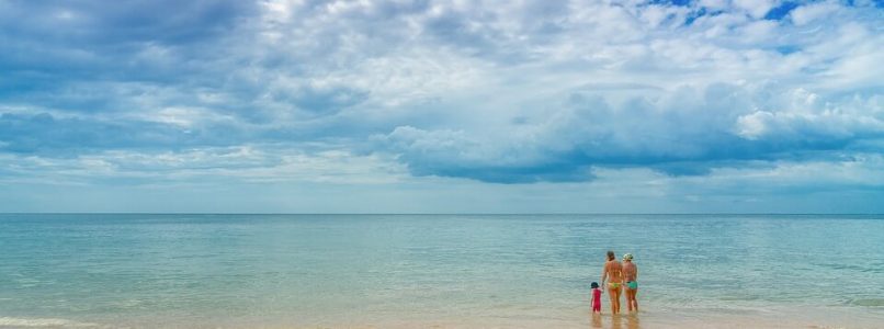 Family wading in the ocean