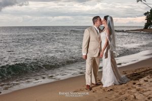 Wedding couple kissing on the beach