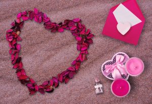 Valentine's Day objects on a beach