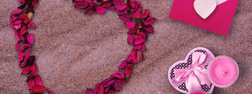 Valentine's Day objects on a beach