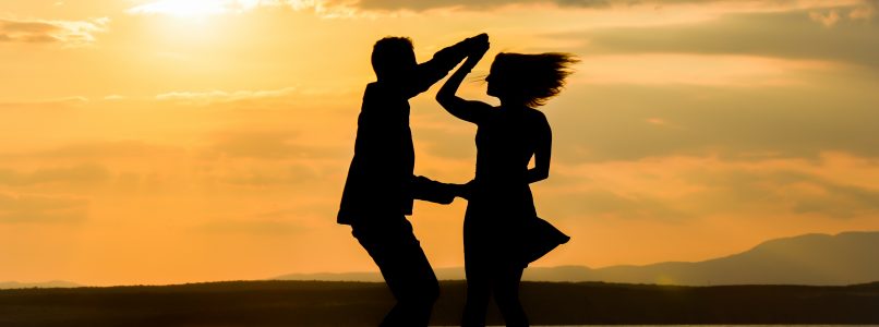 Couple dancing in silhouette.