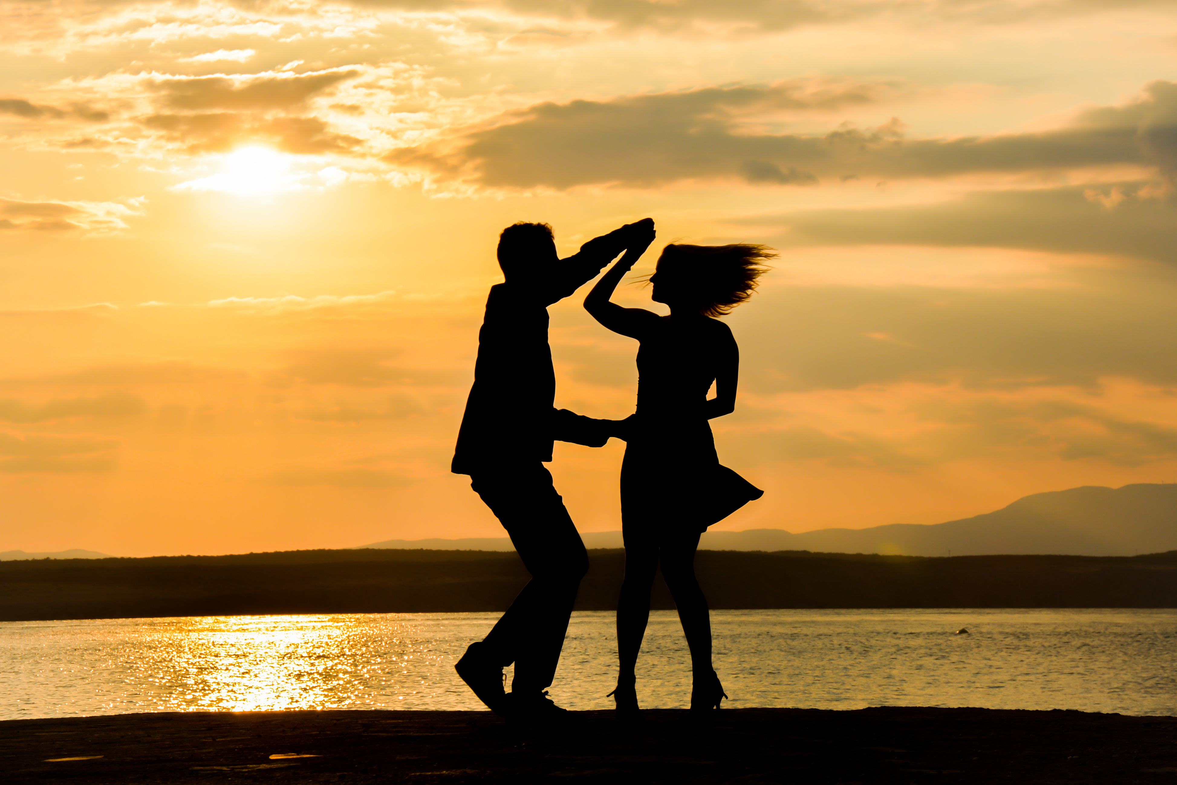 Couple dancing in silhouette.