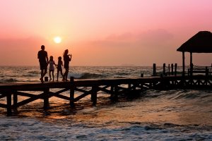 Family on a pier in Rincon, Puerto Rico