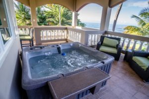 View of ocean from a hot tub on the balcony at Maria's Villa PR