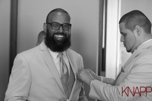 Groom smiling before his wedding at Maria's
