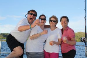 Family celebrating on a boat.