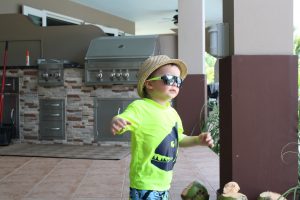 Toddler wearing hat and sunglasses at Maria's Villa PR
