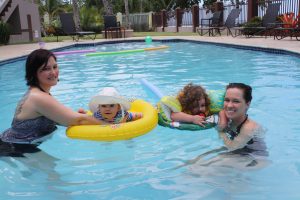 Two mothers and two children playing in pool at Maria's Villa PR