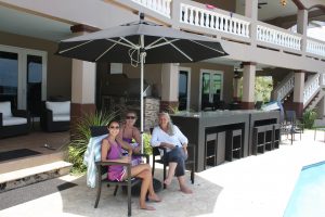 Three women sitting on the patio at Maria's Luxury Villa Rincon PR
