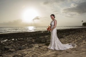 Bride holding bouquet standing on Maria's Beach PR