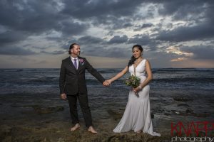 Night time photo of wedding couple at Maria's Beach.