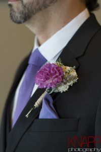 Carnation boutonniere on a wedding party member.