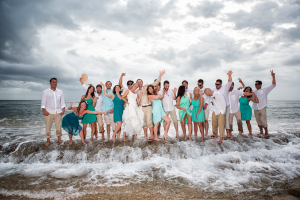 Wedding party posing on beach at Maria's luxury villa