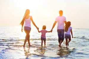 Family walking on the beach