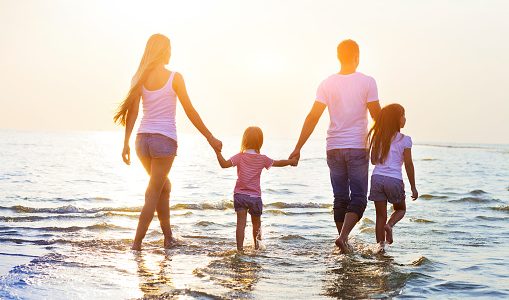 Family walking on the beach