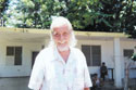 Ramon outside his house, 2000