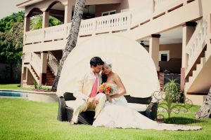 Wedding couple posing on couch at Maria's Villa PR