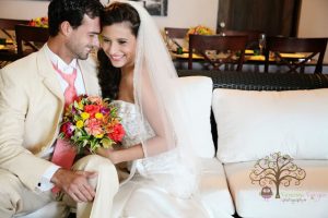 Wedding couple posing on couch at Maria's Villa PR