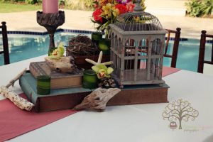 Banquet centerpiece with decorative bird cage and starfish.