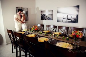 Bride and groom in front of reception table at Maria's Villa PR.