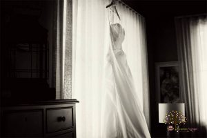 Wedding dress hanging in a room at Maria's Villa Rincon PR