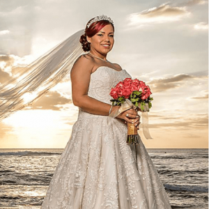 Bride posing in front of a sunset