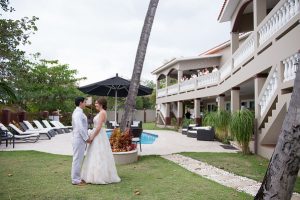 Wedding Couple next to pool at Maria's Villa Rincon, PR