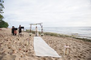 Wedding celebrant and two musicians in place at Maria's Beach